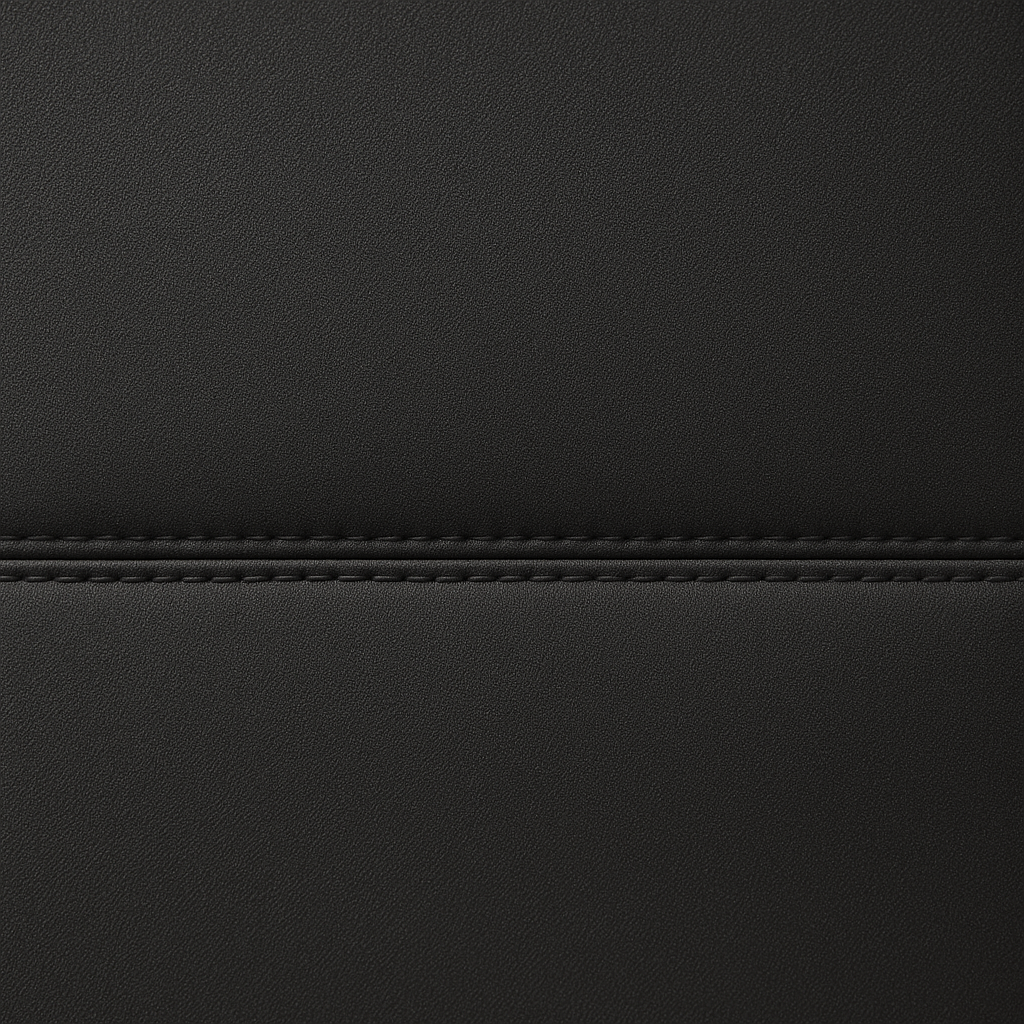 Close-up of black Tuff Skin Neoprene seat-cover material with a stitched seam.
